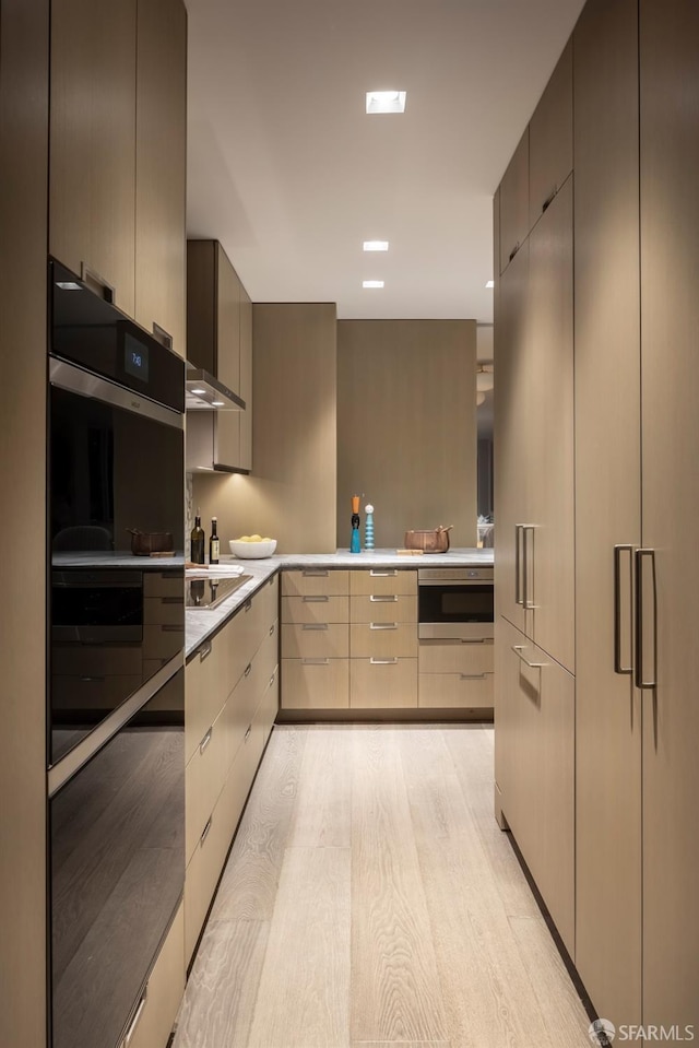 kitchen with black cooktop and light wood-type flooring