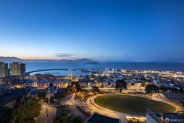 property's view of city featuring a water and mountain view