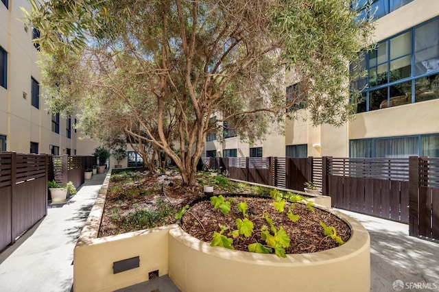 view of community featuring fence