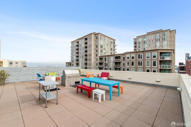 view of patio featuring a grill