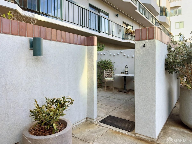 view of patio with a balcony