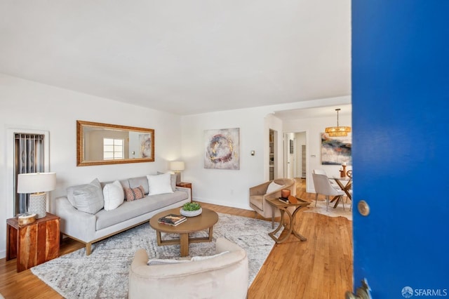 living room featuring baseboards and wood finished floors