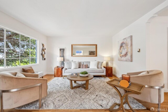 living room with wood finished floors and baseboards