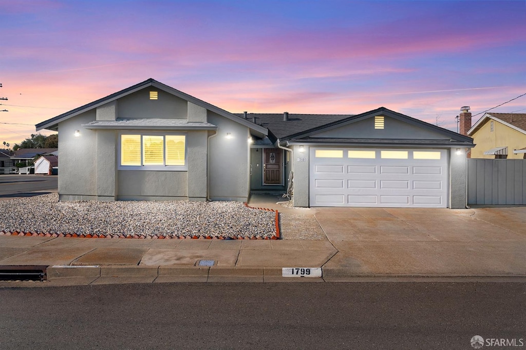 ranch-style home featuring a garage