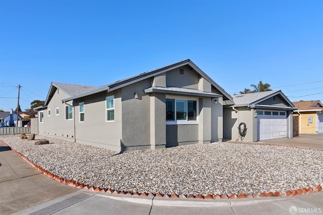 ranch-style house featuring a garage