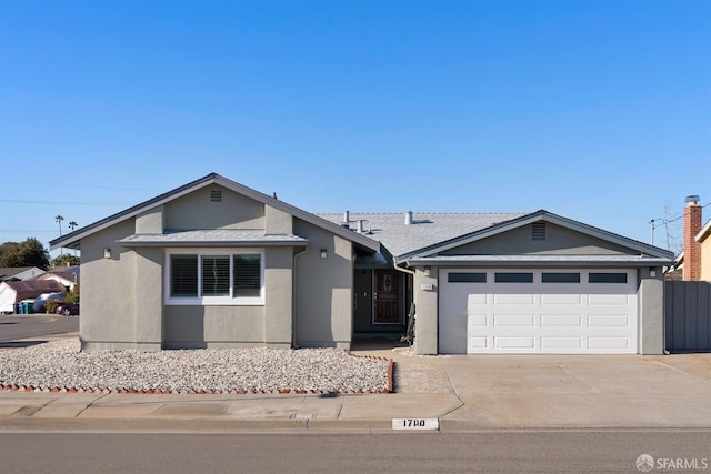 ranch-style home featuring a garage