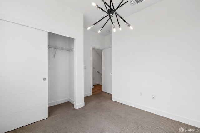 3821 Wattling St, Oakland, CA 94601 - unfurnished bedroom featuring carpet floors, a chandelier, a closet, and baseboards