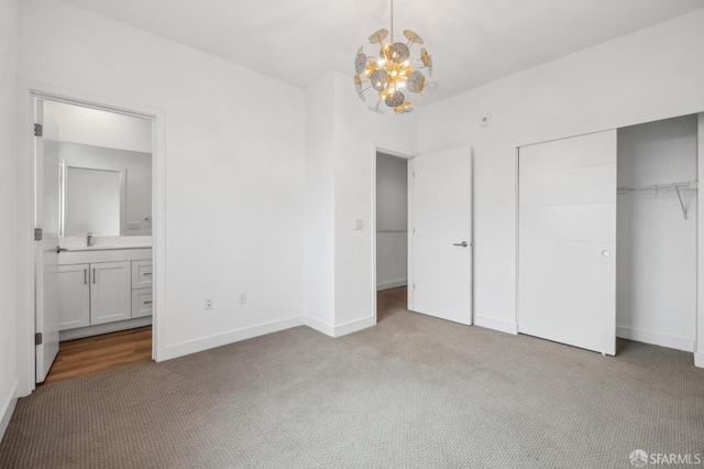 3821 Wattling St, Oakland, CA 94601 - unfurnished bedroom featuring carpet floors, a chandelier, a closet, ensuite bath, and baseboards