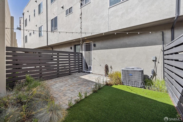 3821 Wattling St, Oakland, CA 94601 - rear view of house with central air condition unit, stucco siding, and a patio area