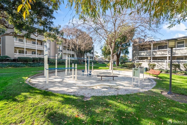 view of jungle gym featuring a lawn