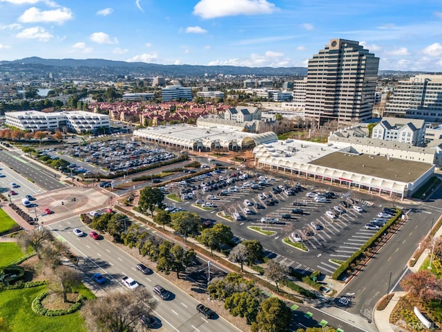 birds eye view of property with a mountain view