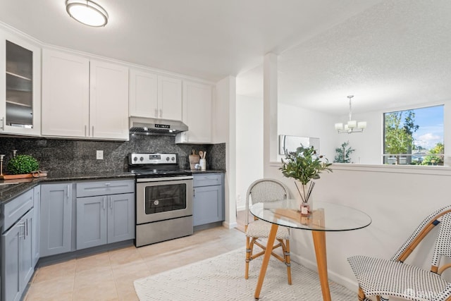 kitchen featuring decorative light fixtures, white cabinetry, stainless steel electric range, and light tile patterned flooring