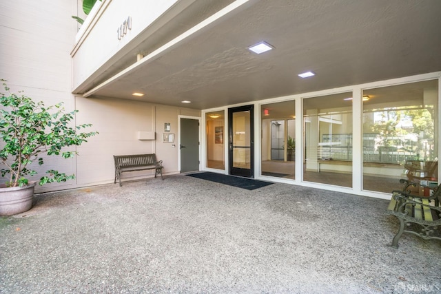 entrance to property with a patio