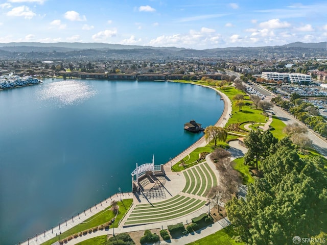 drone / aerial view with a water and mountain view