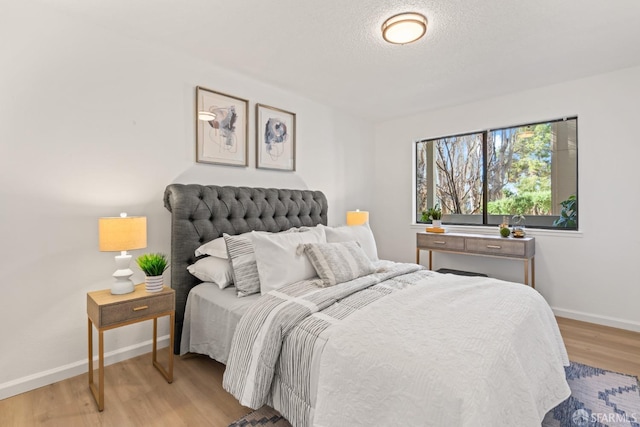 bedroom with light hardwood / wood-style floors