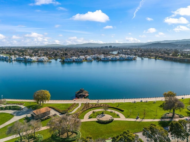 bird's eye view with a water and mountain view