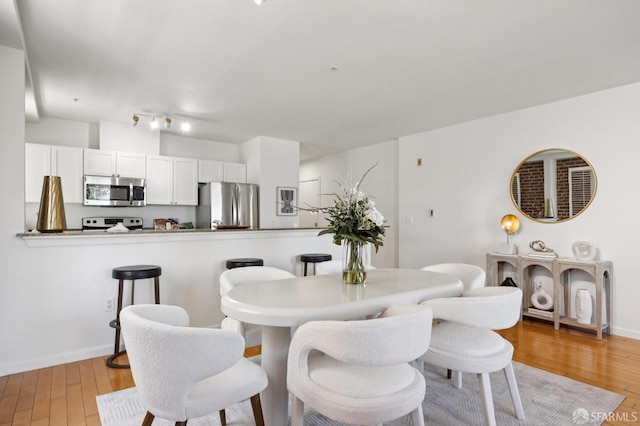 323 29th St Unit C301, San Francisco, CA 94131 - dining area with light wood-style floors and baseboards