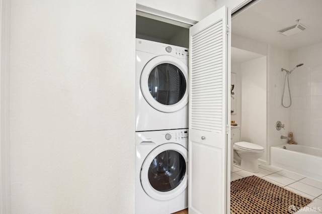 323 29th St Unit C301, San Francisco, CA 94131 - laundry room with stacked washing machine and dryer and tile patterned flooring