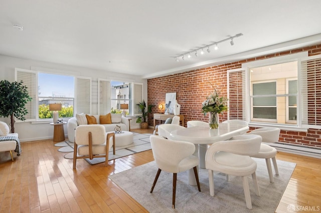 323 29th St Unit C301, San Francisco, CA 94131 - dining room with light wood-style flooring and brick wall