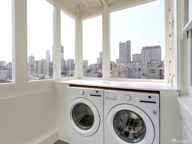 laundry room with independent washer and dryer