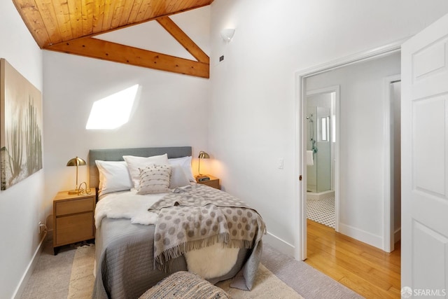 bedroom with wooden ceiling, vaulted ceiling with beams, baseboards, and wood finished floors