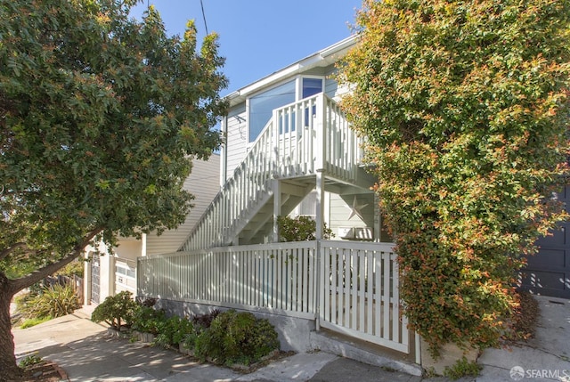 view of side of property with stairs