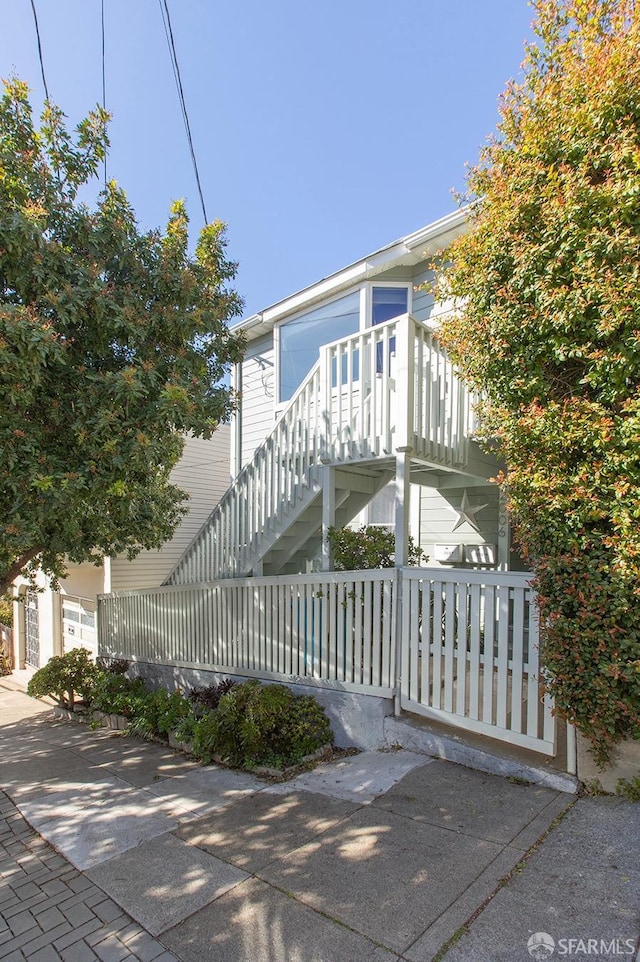 view of property exterior featuring stairway