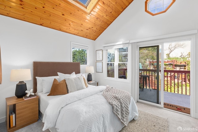 bedroom featuring carpet, wood ceiling, a skylight, high vaulted ceiling, and access to outside