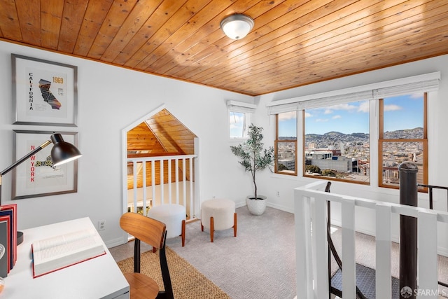 office with wood ceiling, baseboards, and carpet floors