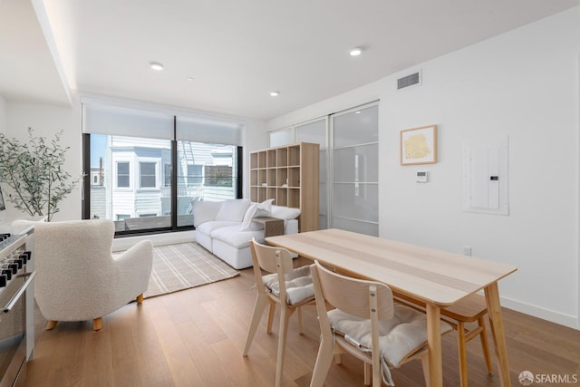 2448 Lombard St Unit 313, San Francisco, CA 94123 - dining area with electric panel and hardwood / wood-style floors