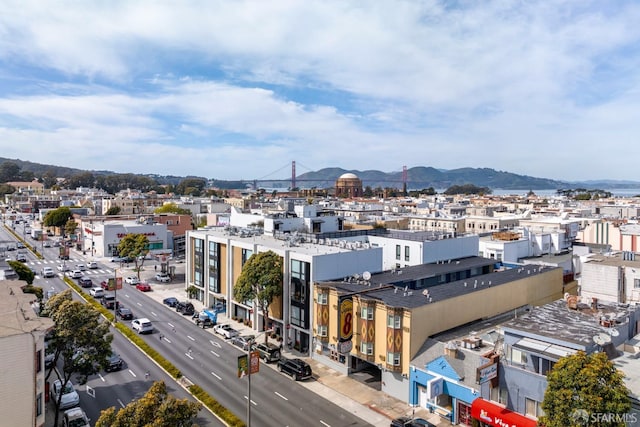 property's view of city with a mountain view