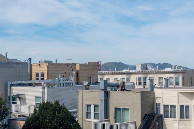 property's view of city featuring a mountain view