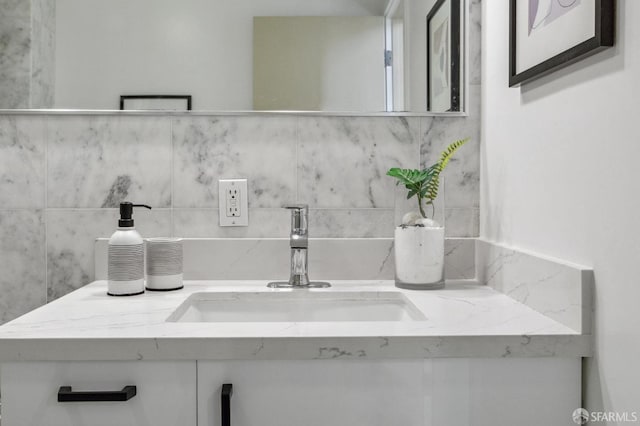 bathroom featuring decorative backsplash and vanity