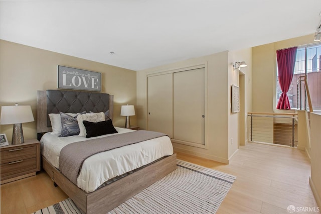 bedroom featuring a closet and light hardwood / wood-style floors