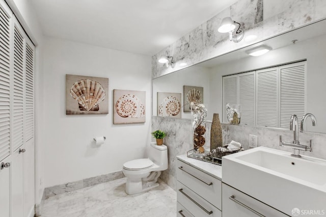 bathroom with toilet and vanity