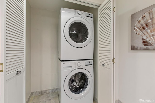 laundry area with stacked washing maching and dryer