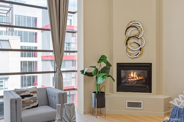 sitting room with hardwood / wood-style flooring