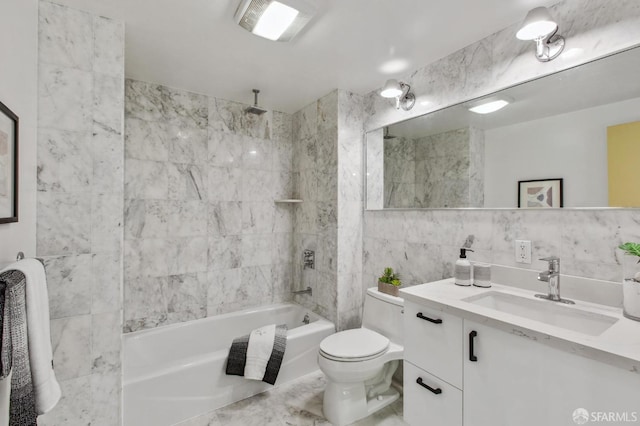 full bathroom featuring toilet, vanity, tile walls, and bathing tub / shower combination