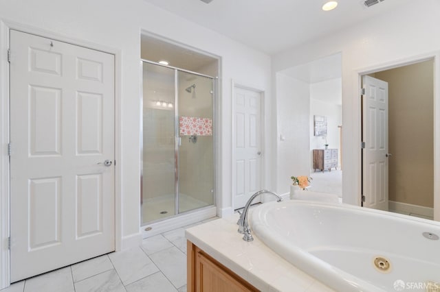 bathroom featuring separate shower and tub and tile patterned flooring