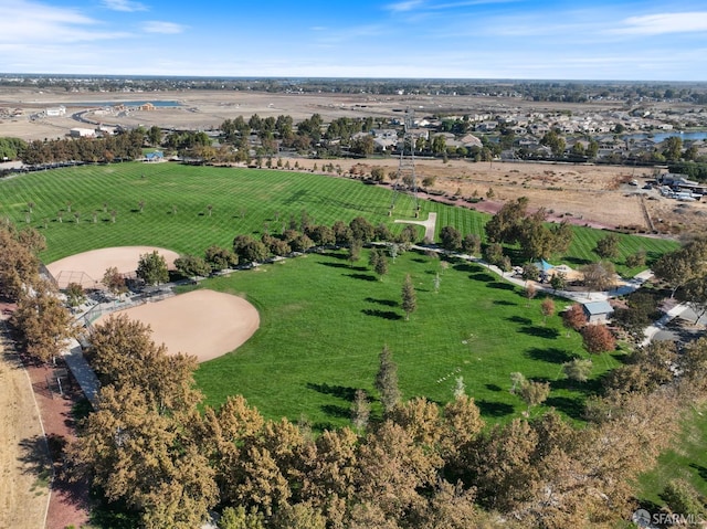 birds eye view of property with a rural view