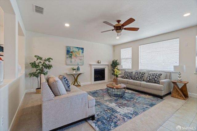 tiled living room featuring ceiling fan