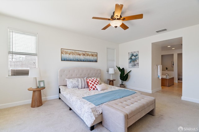 bedroom featuring light colored carpet and ceiling fan