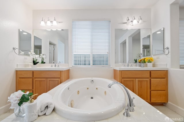 bathroom with tiled tub and vanity