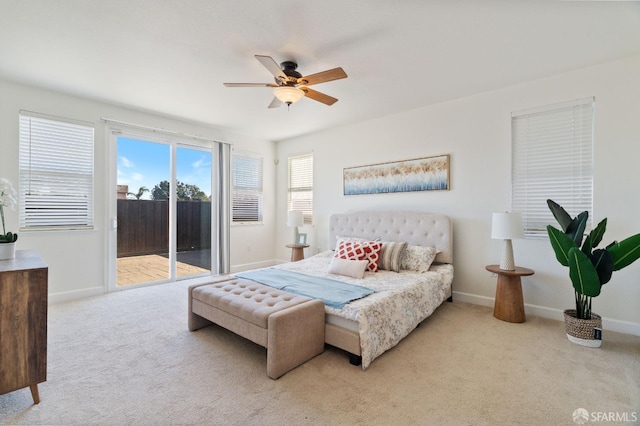 bedroom featuring ceiling fan, light colored carpet, and access to outside