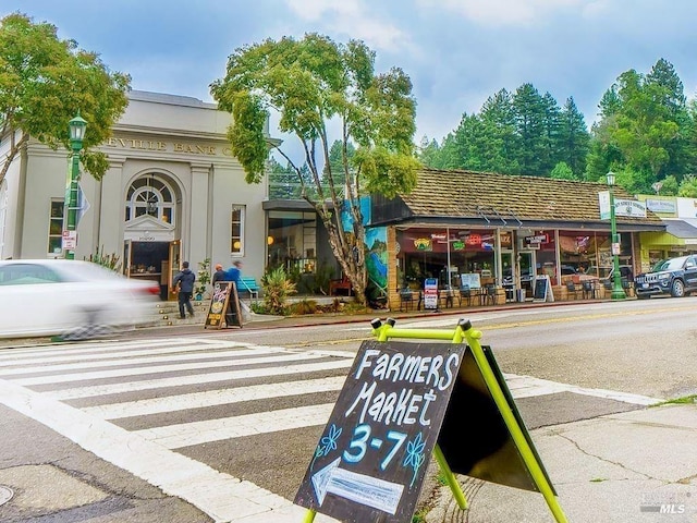 exterior space with sidewalks and street lighting