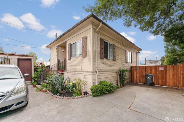 view of side of home featuring a patio area