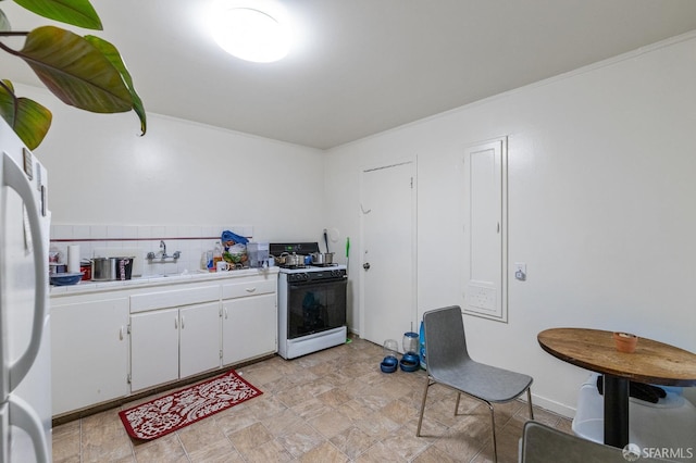 kitchen with tasteful backsplash, white cabinets, white appliances, ornamental molding, and sink