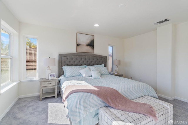 bedroom with light carpet, baseboards, visible vents, and recessed lighting