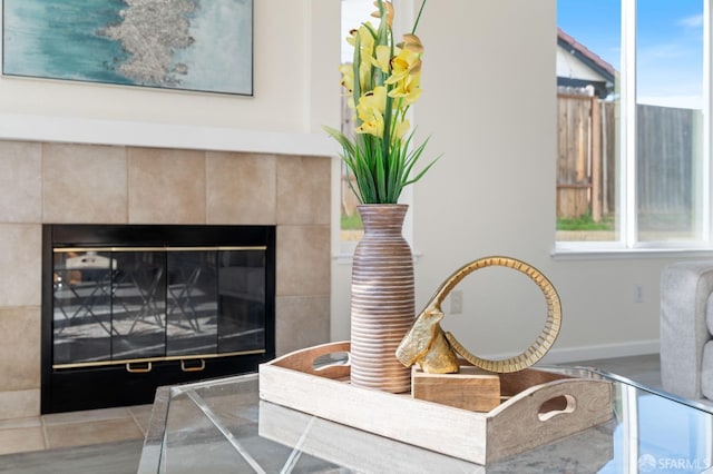 interior details with a fireplace and baseboards