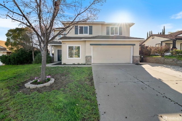 view of front of property featuring an attached garage, driveway, stone siding, and a front yard